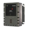 Macurco CM-6 carbon monoxide detector mounted on wall, featuring digital display and compact design for safety monitoring.