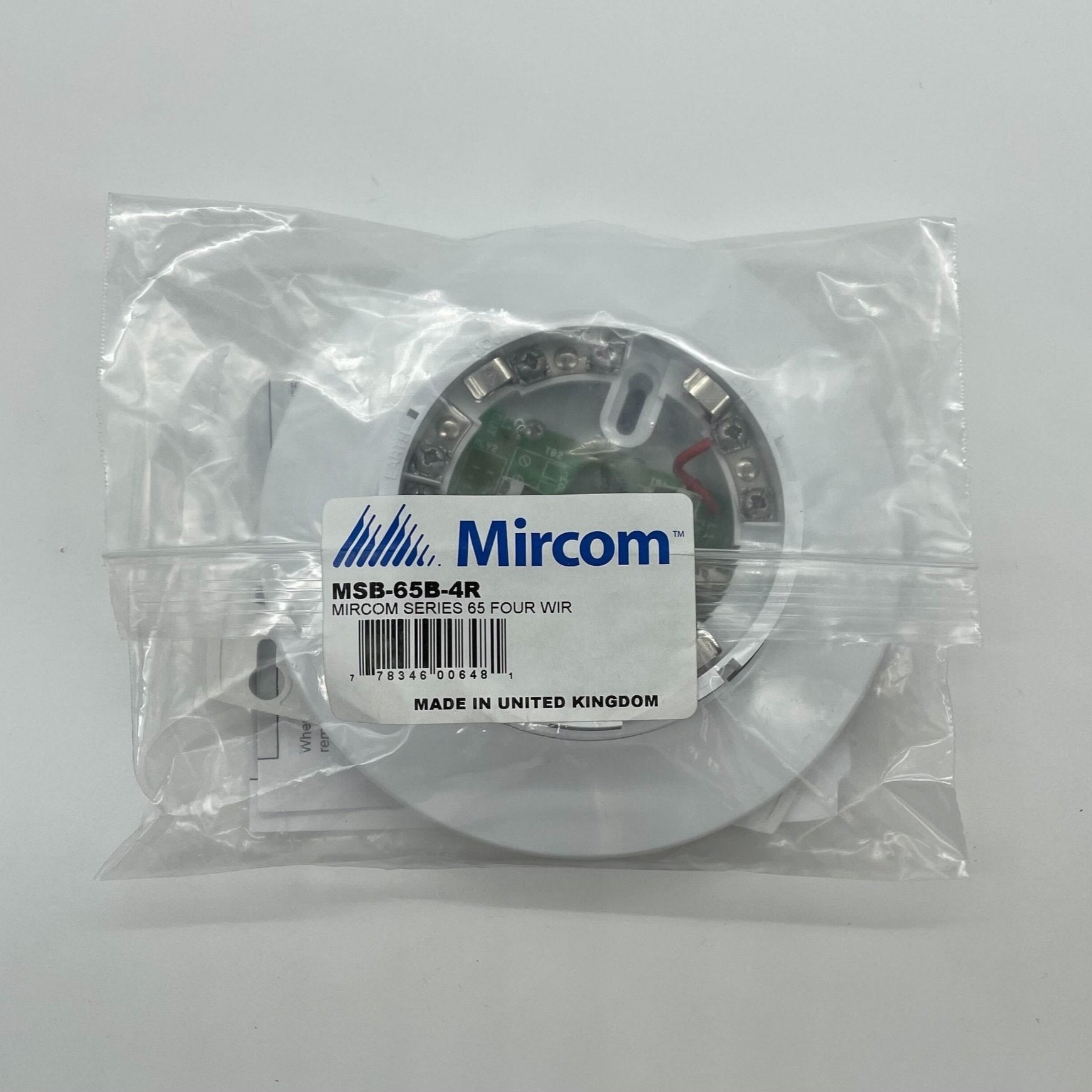 Mircom MSB-65B-4R fire alarm control panel with red and black buttons, mounted on a white wall for emergency system management.