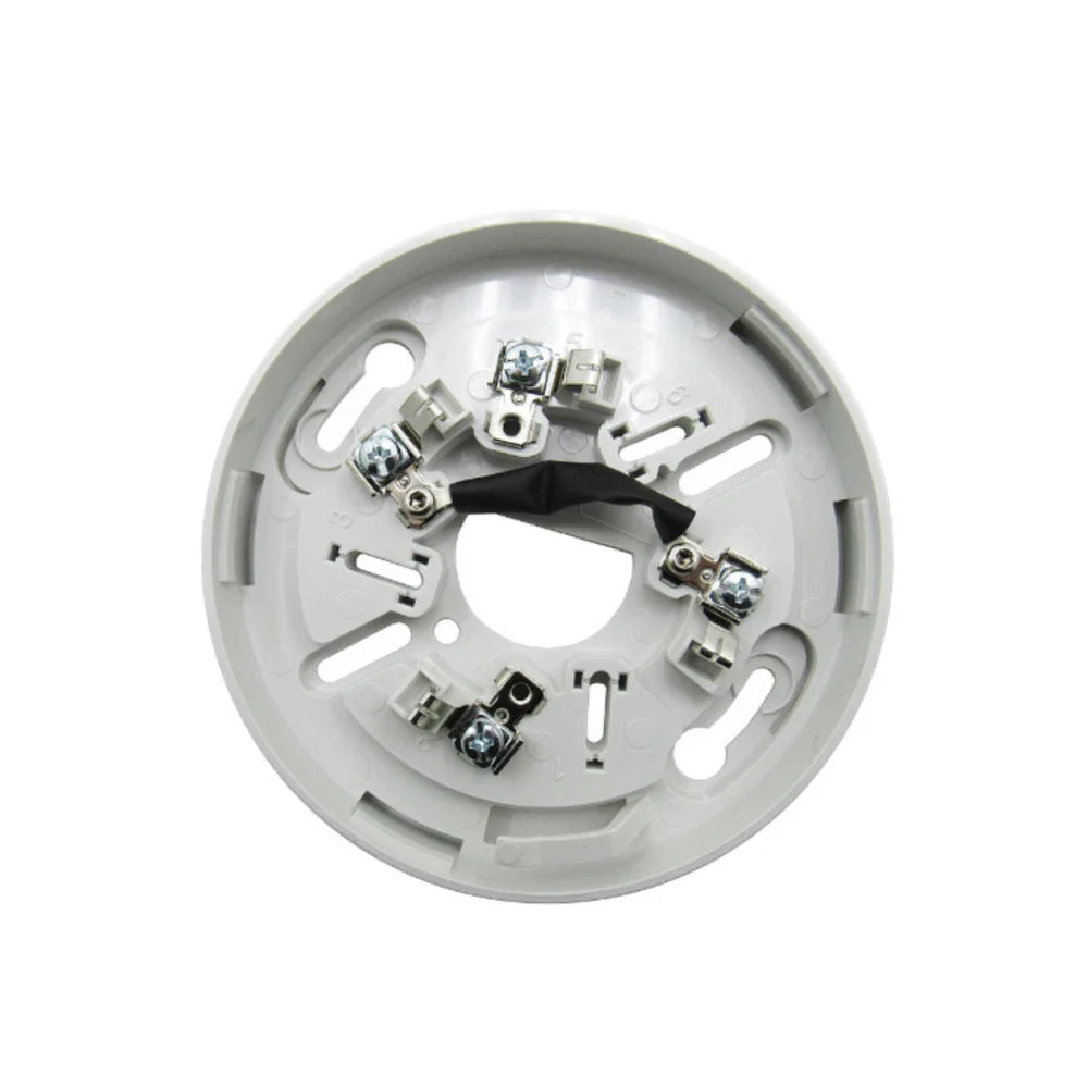 Kidde KI-SB smoke and carbon monoxide detector mounted on a ceiling, white plastic housing with electronic sensor components.