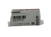 Siemens TSM-1 fire alarm device with red indicator light and mounting bracket, designed for fire safety systems.