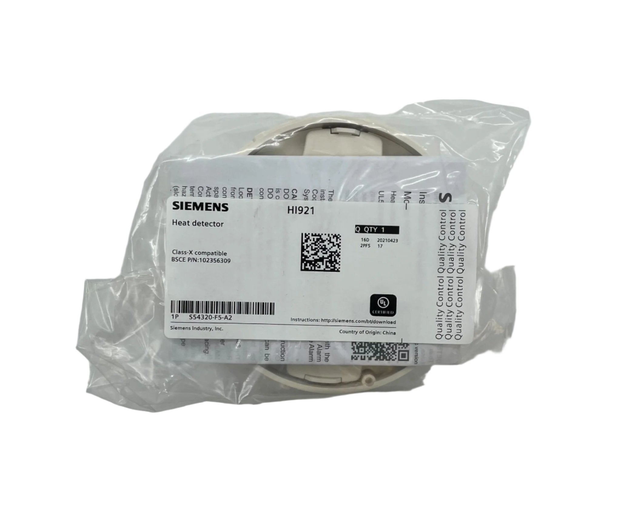 Siemens HI921 heat detector mounted on a ceiling, part of Siemens fire safety system for detecting high temperatures.