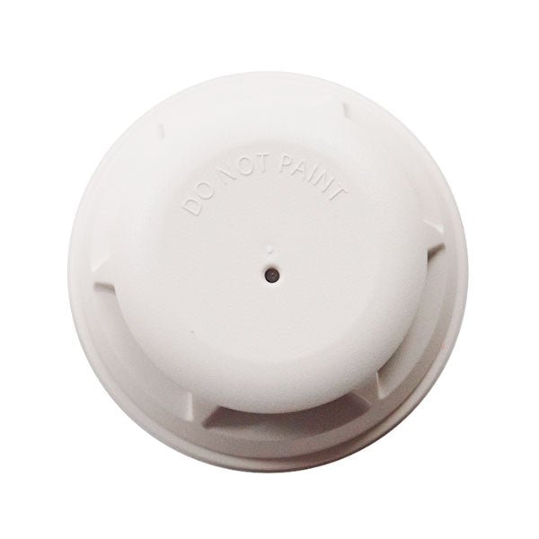 Siemens OP921 smoke detector mounted on ceiling, electronic safety device for alerting to smoke or fire hazards.