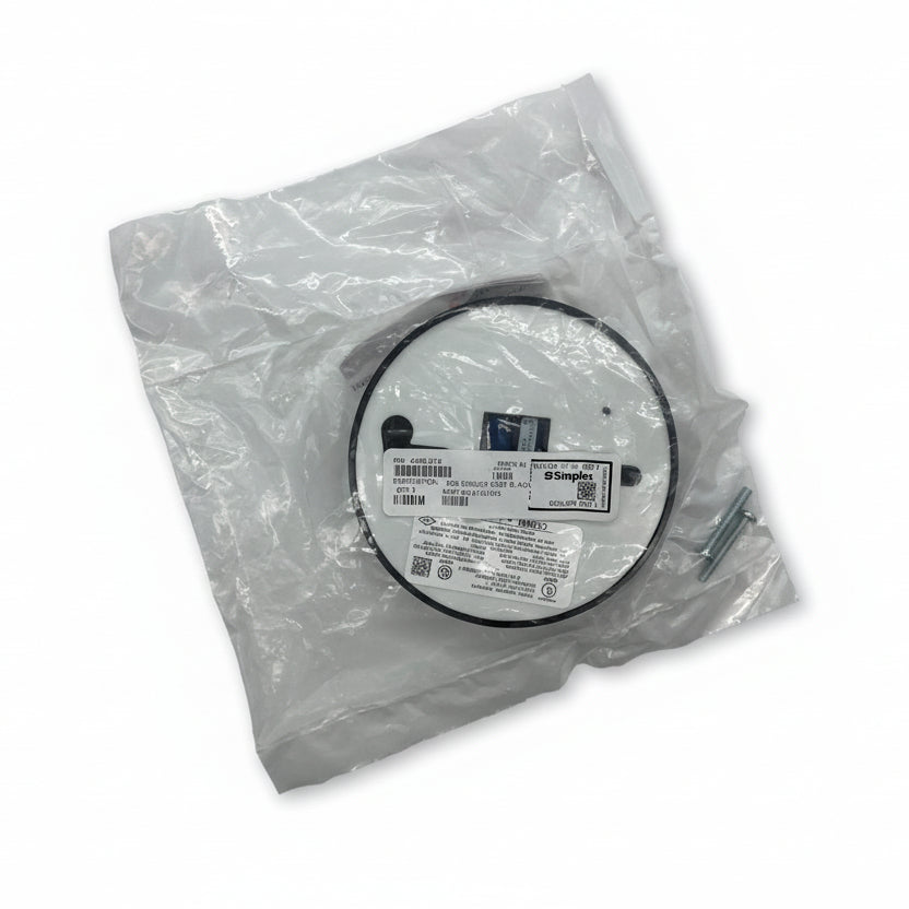 Simplex 4098-9776 smoke detector mounted on ceiling, black and white detector with wiring visible for fire safety systems.