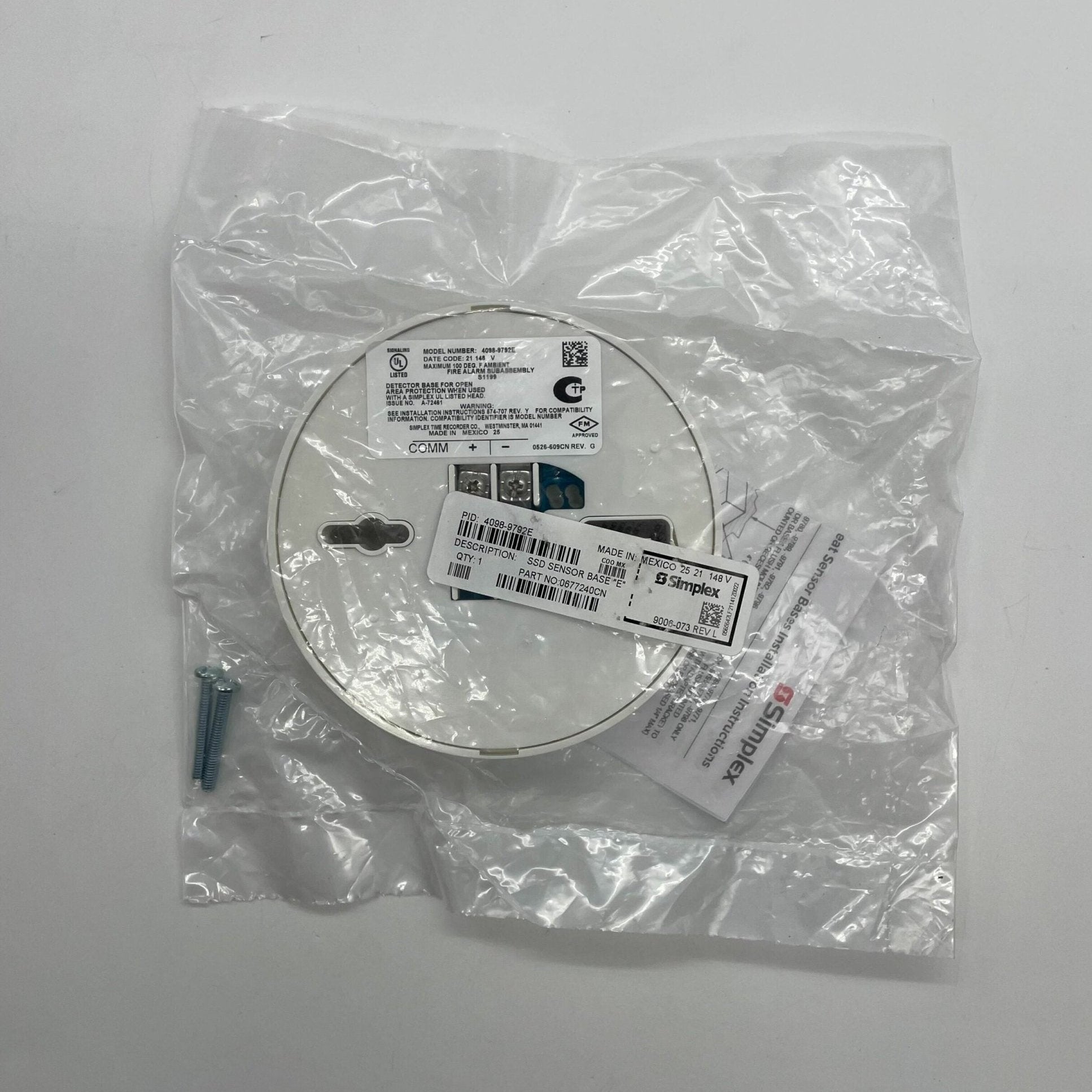 Simplex 4098-9792E fire alarm sensor showing its ULC-certified system sensor with wiring connections and mounting hardware.