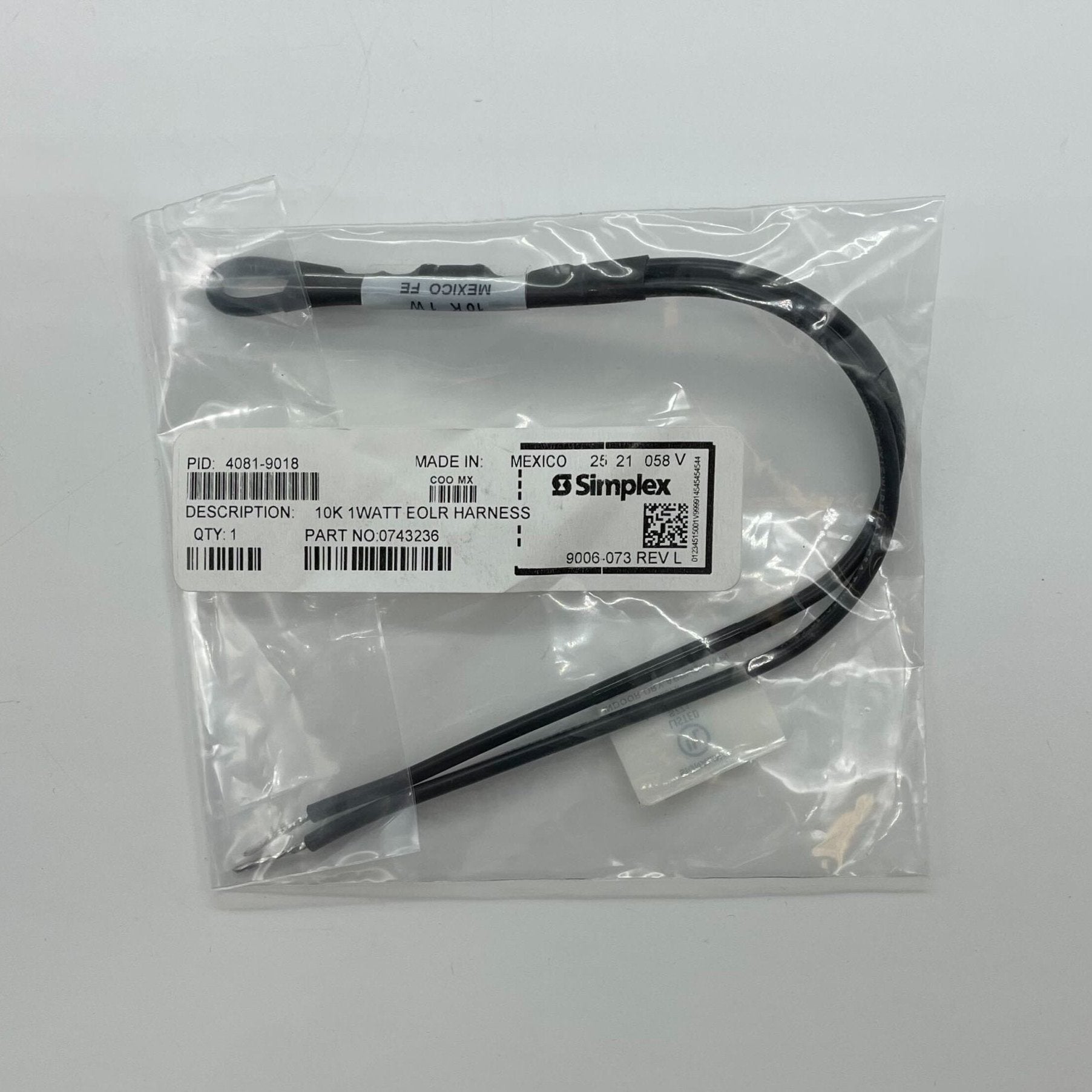 Simplex 4081-9018 EOL resistors shown on a circuit board, featuring black cylindrical components with metal leads.
