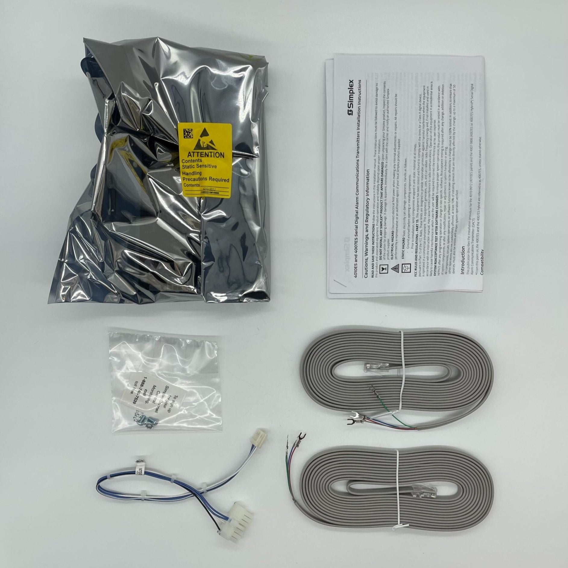 Simplex 4010-9912 fire alarm device with electronic components, part of Simplex's fire alarm system.