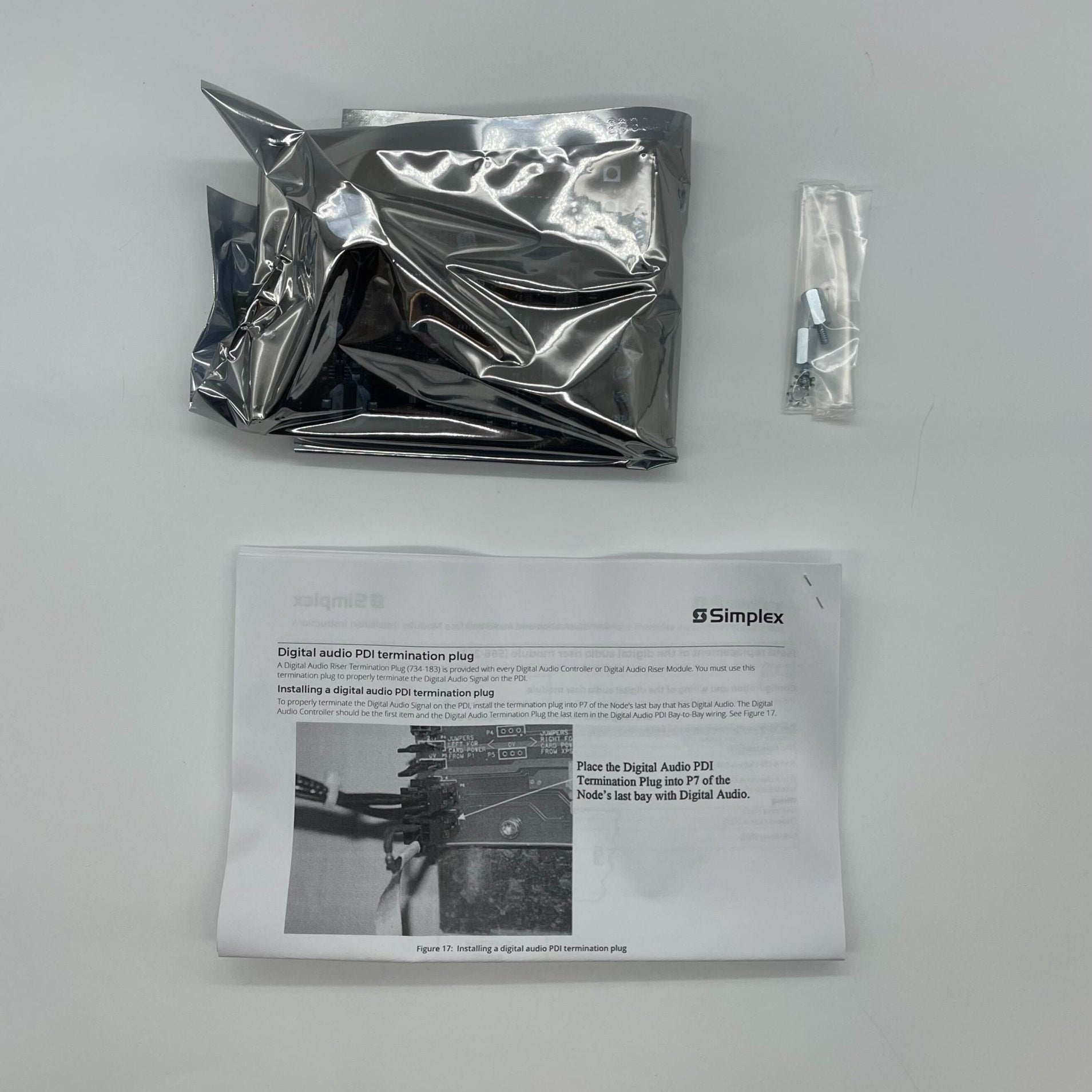 Simplex 4100-0625 fire alarm sensor with system components, mounted on a wall for fire detection and safety.