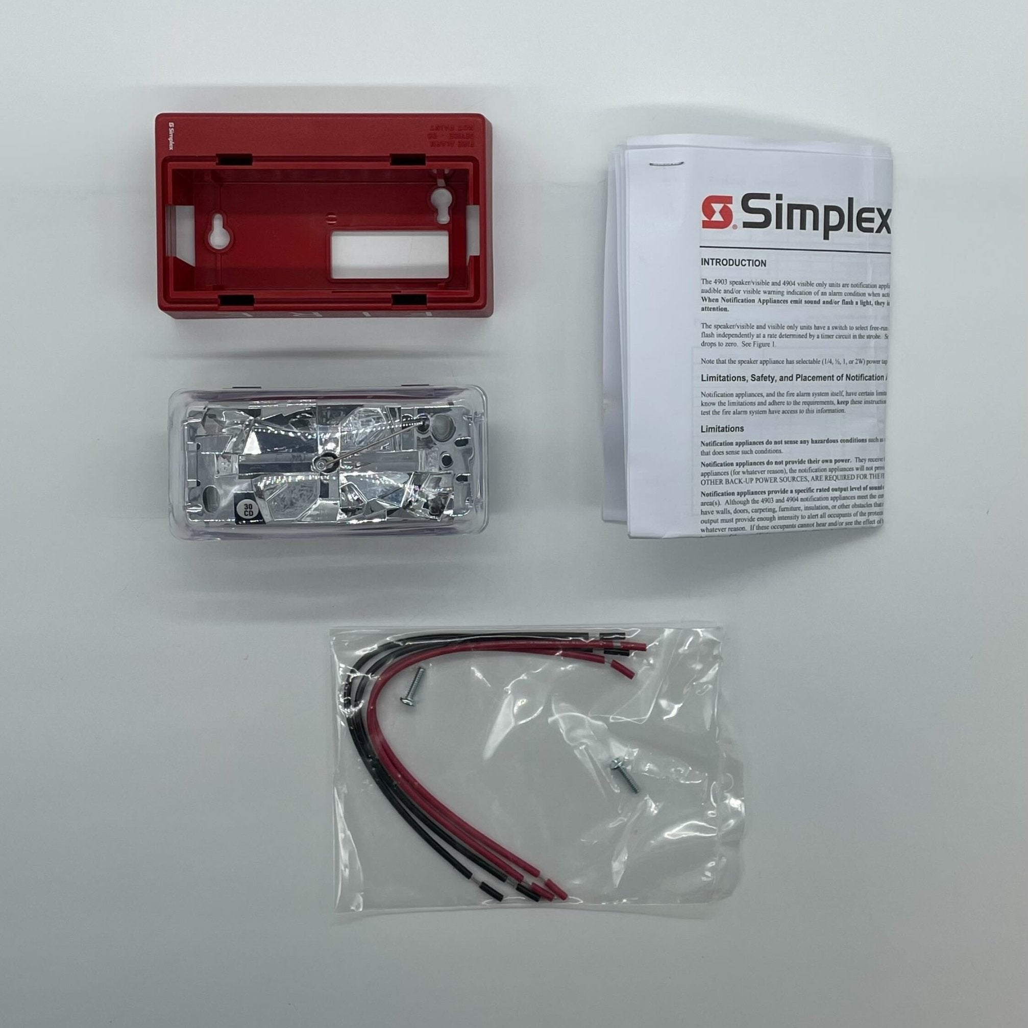 Simplex 4904-9184 fire alarm device with testing and indicator features, mounted on a wall for building safety.