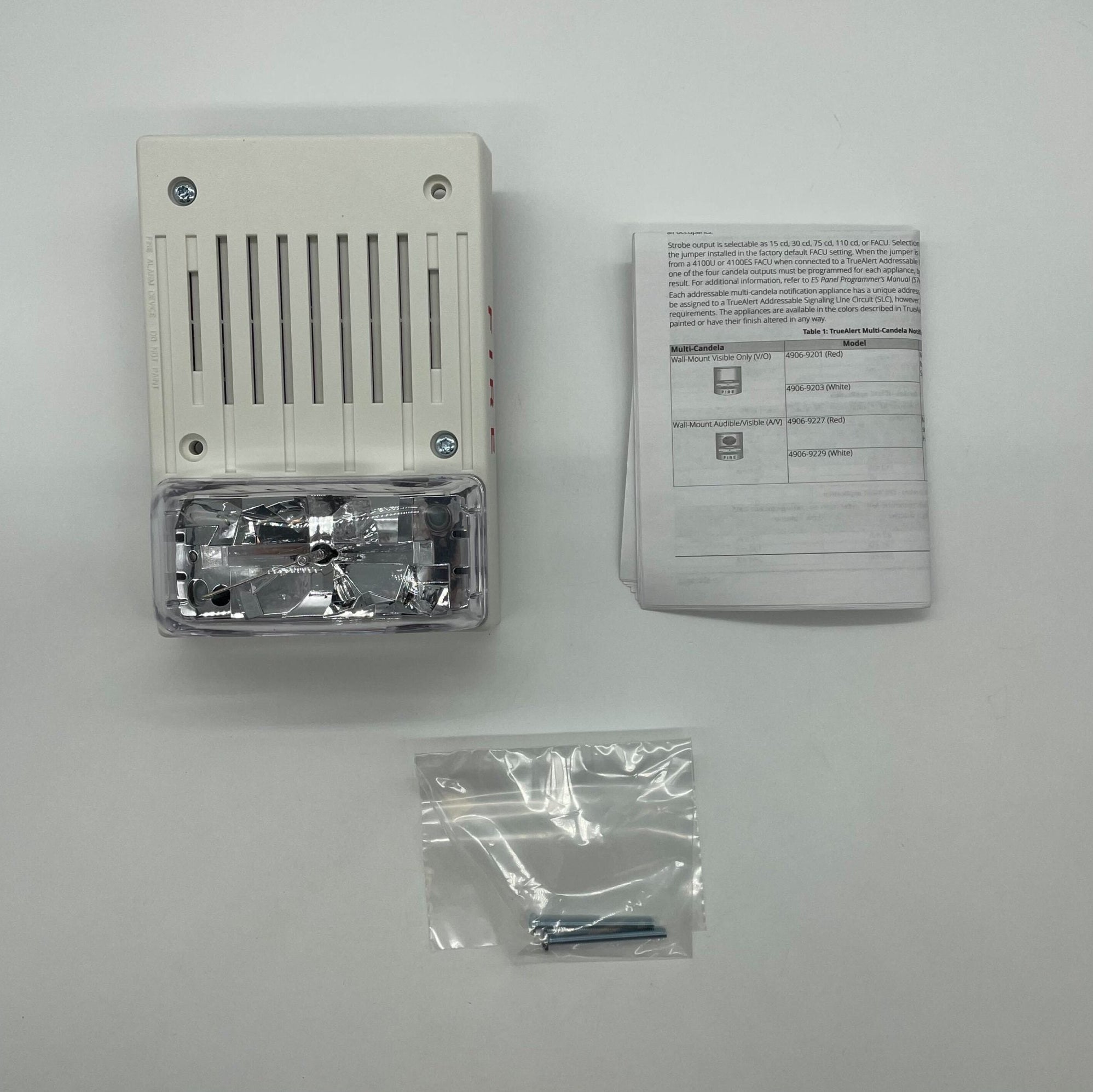 Simplex 4906-9230 fire alarm device mounted on wall, part of Simplex fire alarm system for safety and emergency alerting.