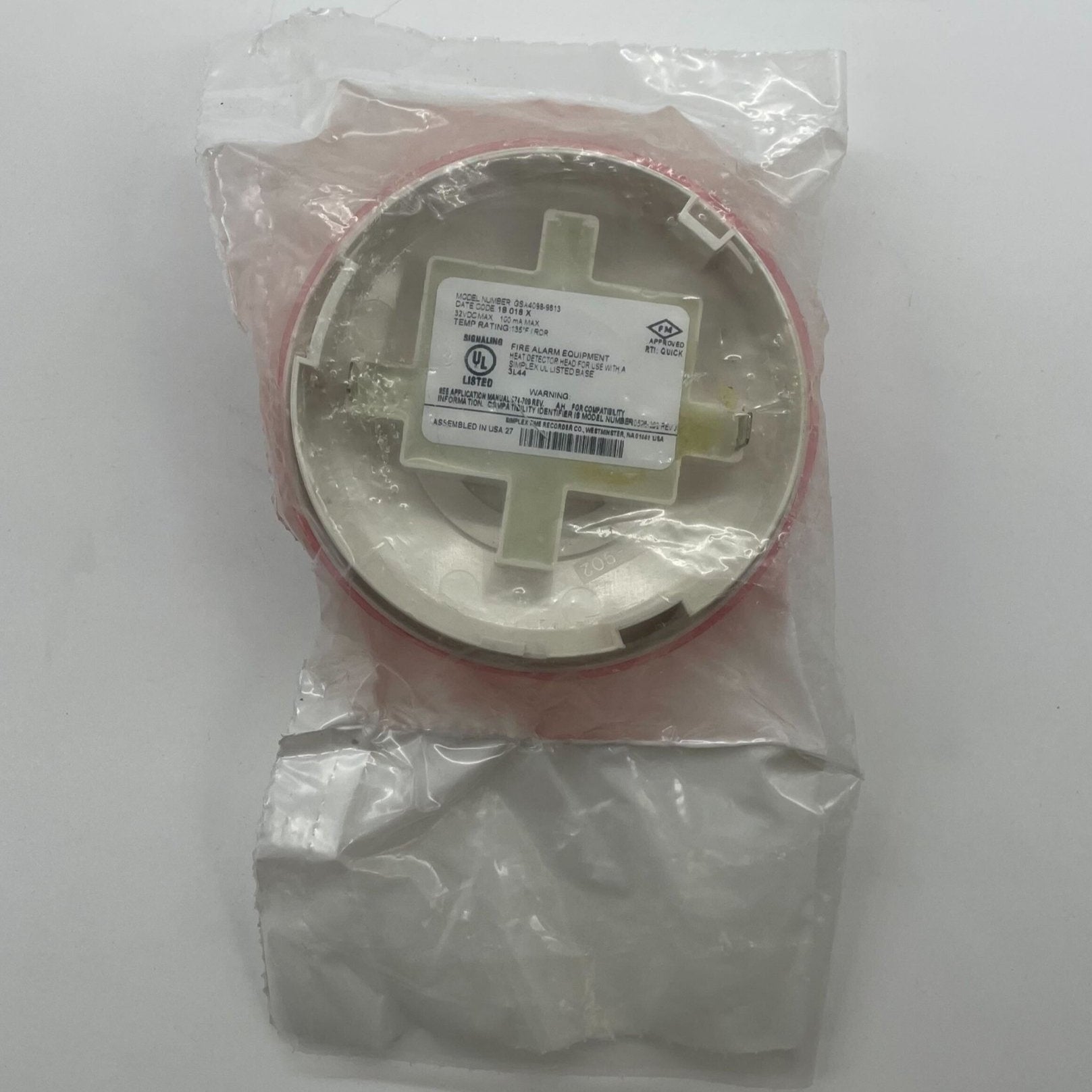 Simplex GSA4098-9613 heat detector mounted on ceiling, part of fire safety system by Simplex, in a commercial building setting