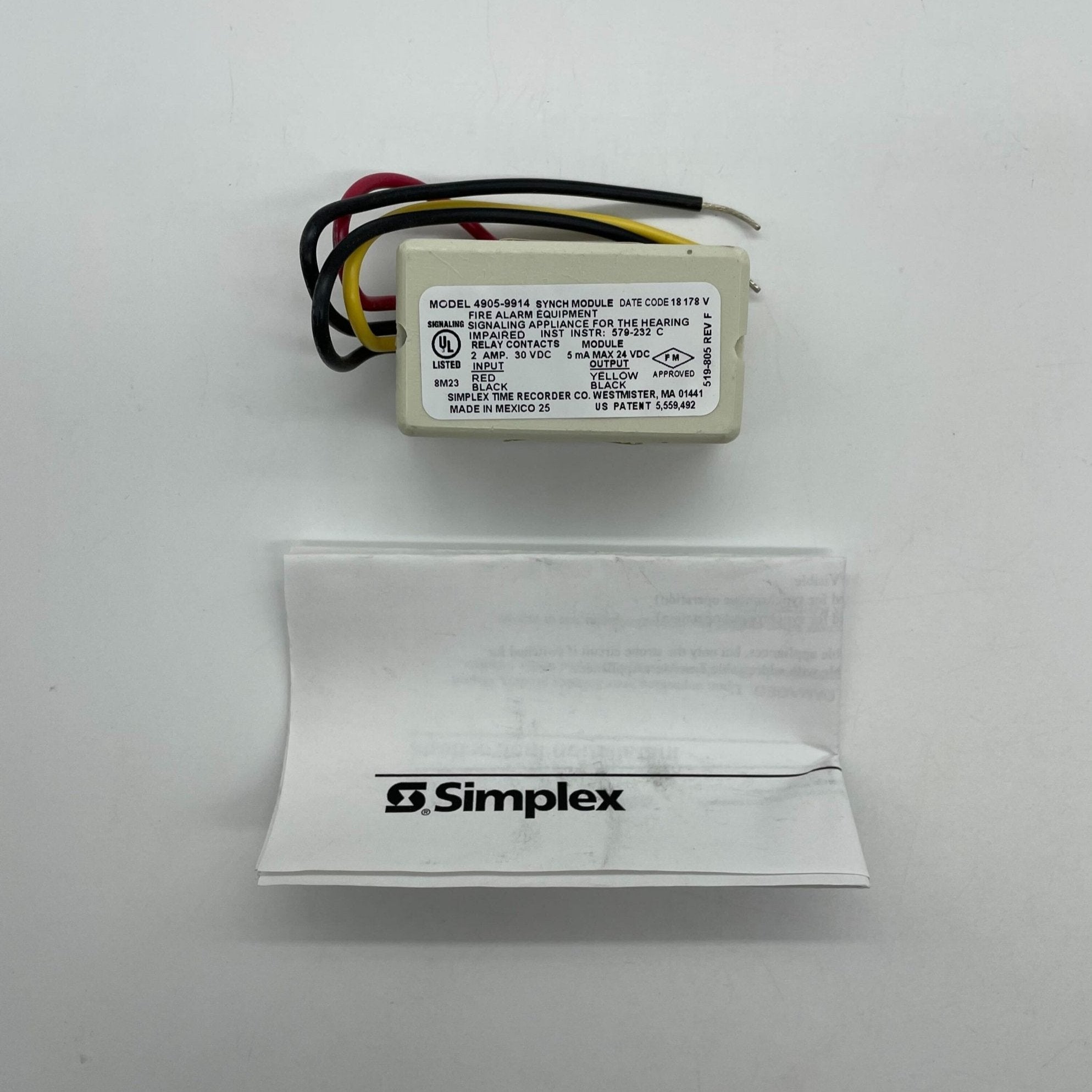 Simplex 4905-9914 fire alarm sensor installed on ceiling, part of Simplex fire alarm system for safety and early fire detection.