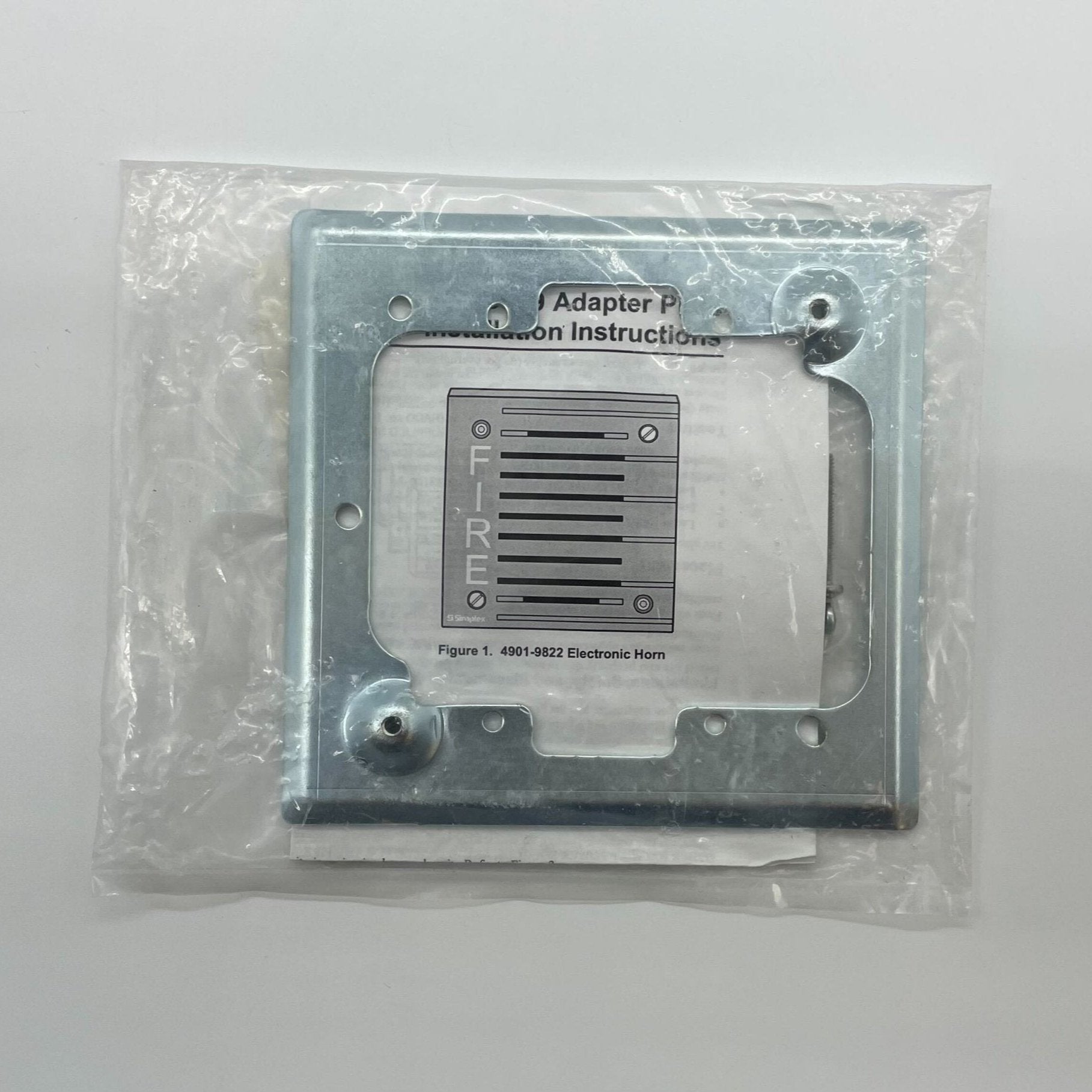 Simplex 4905-9909 fire alarm device from Simplex, showing its compact, wall-mounted design with test and alarm indicators.
