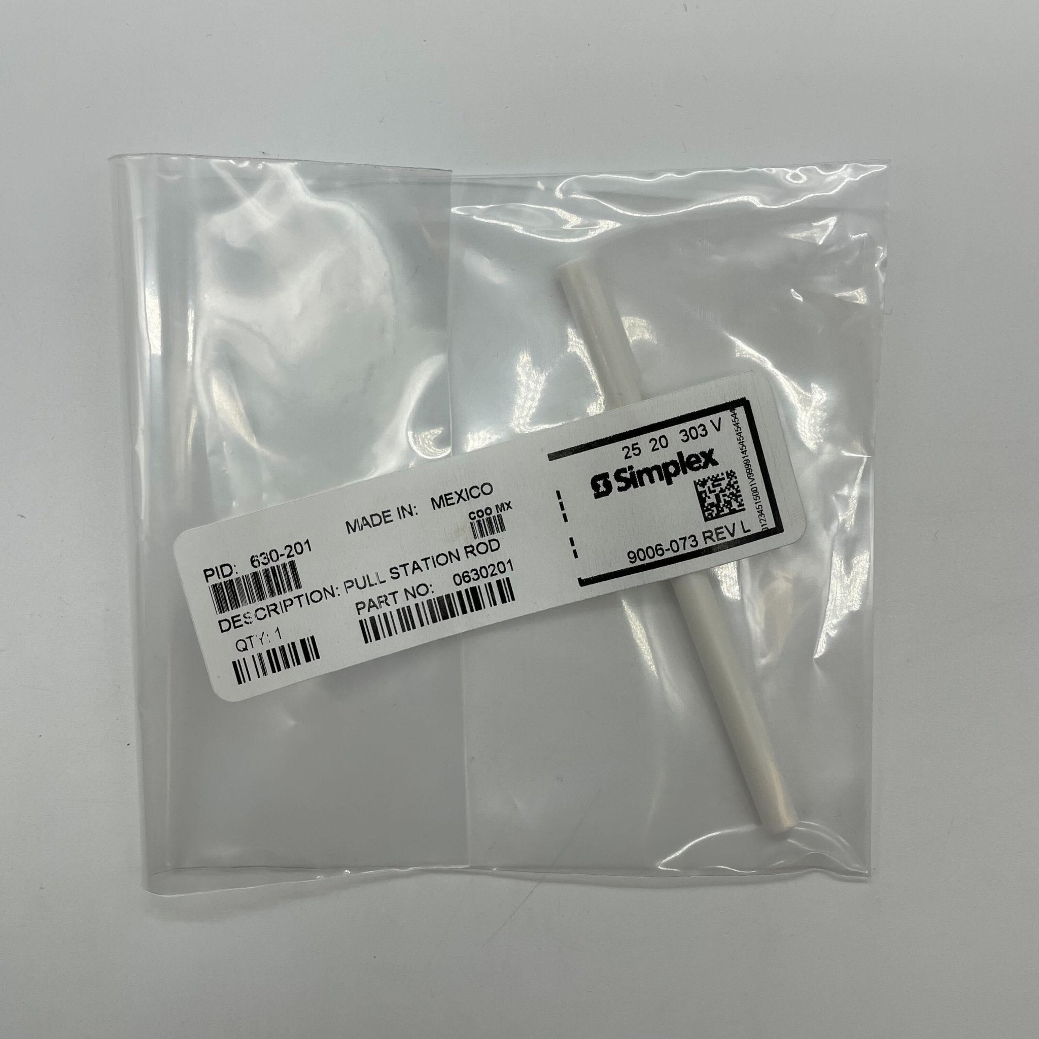Simplex 630-201 pull station, fire alarm handle with clear label, mounted on wall for emergency use.