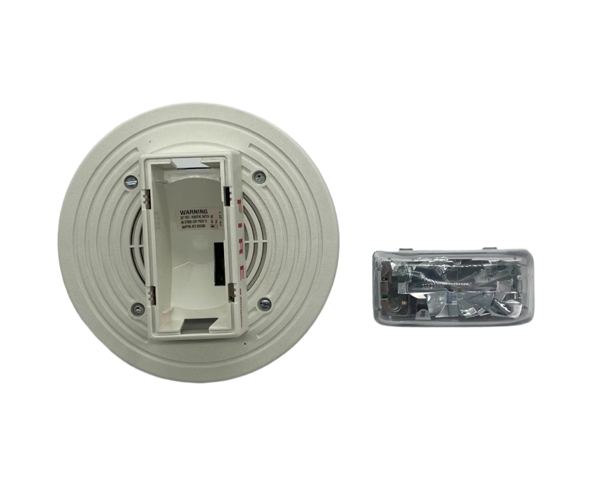 Simplex 4903-9197 fire alarm with white plastic housing and mounting bracket for commercial safety systems.