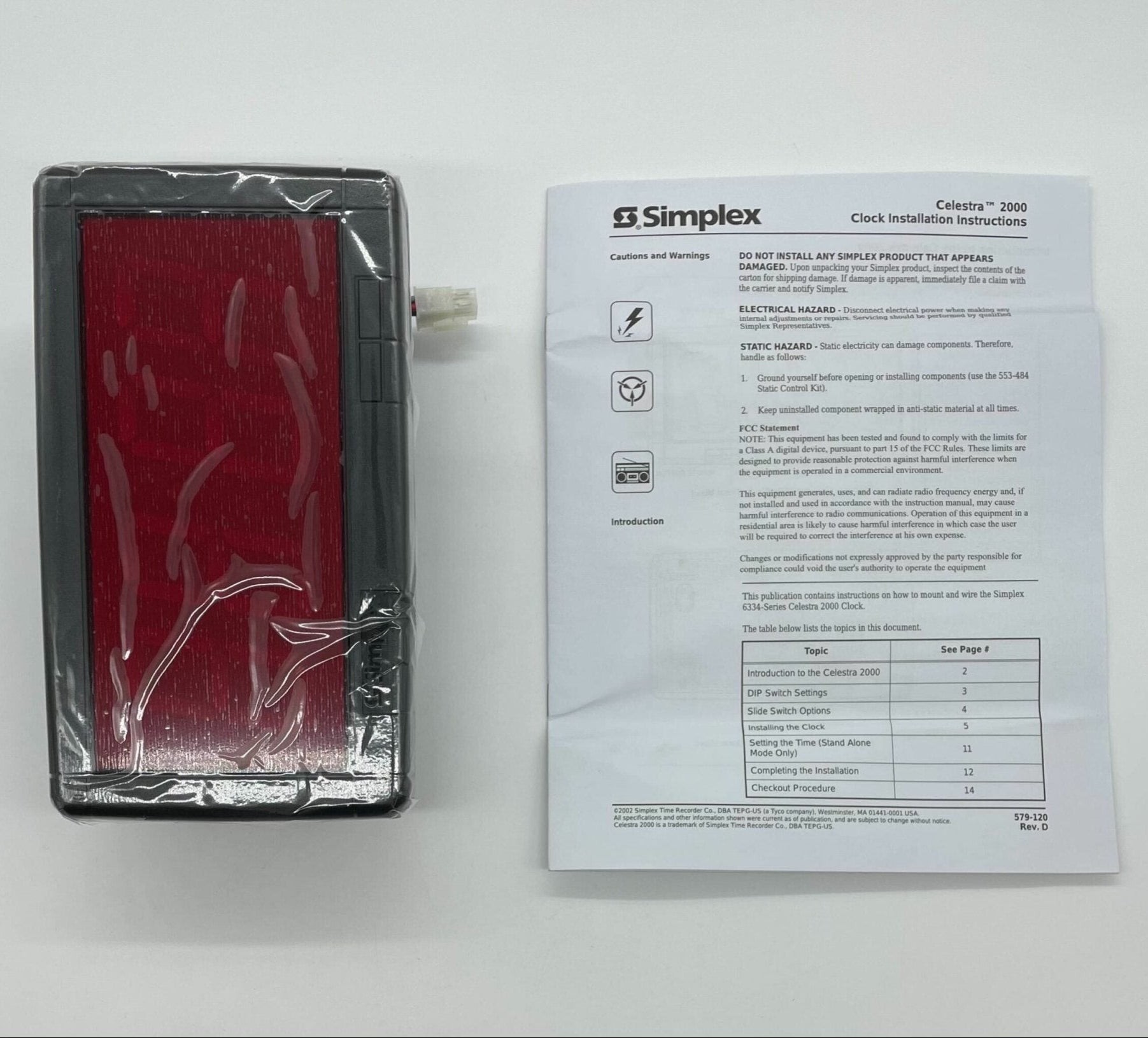 Simplex 6334-9125 fire alarm with white plastic housing and mounting bracket, designed for building safety systems.