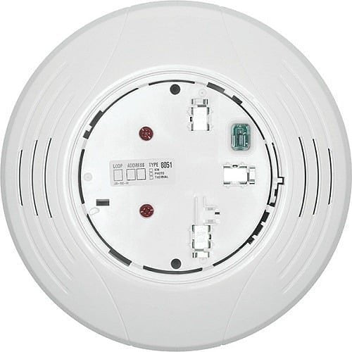 System Sensor B200S-LF-WH smoke detector mounted on ceiling in a building interior.