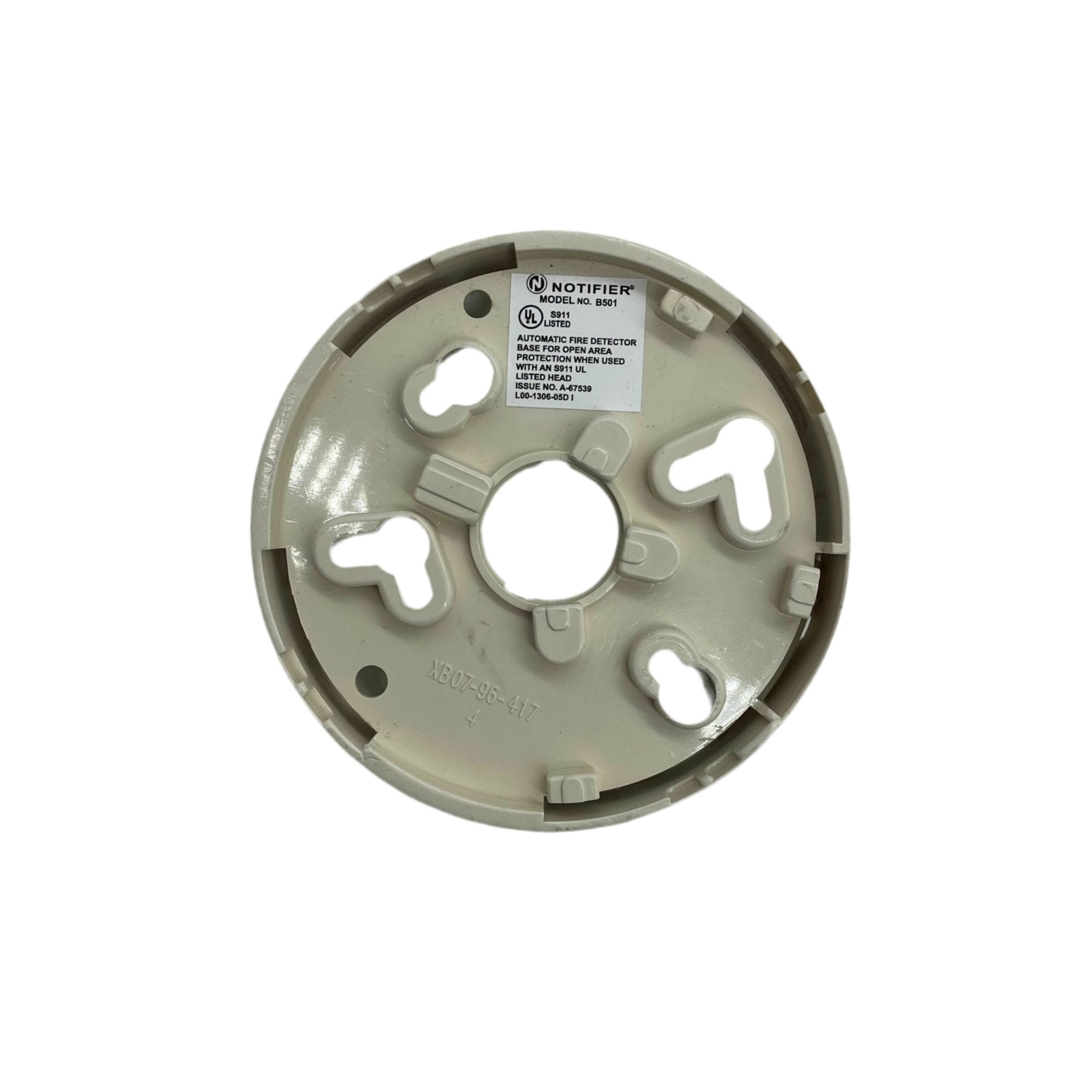System Sensor B501 fire alarm sensor mounted on wall, showing its compact design and detection components for safety systems.