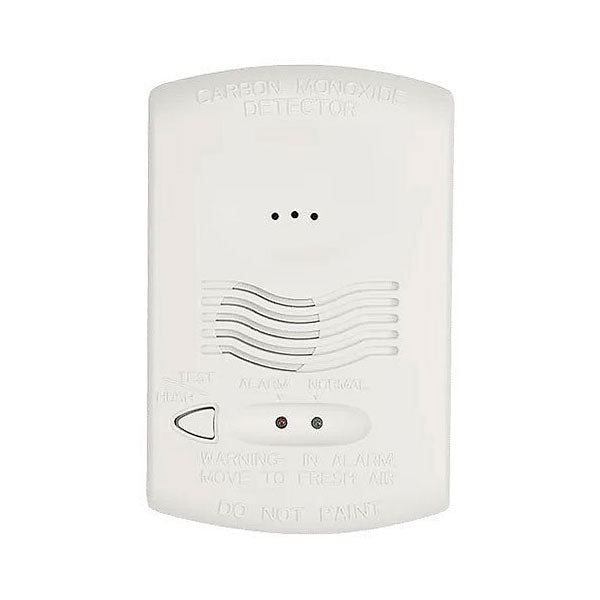 System Sensor CO1224T carbon monoxide detector with digital display, mounted on a wall in a residential setting.