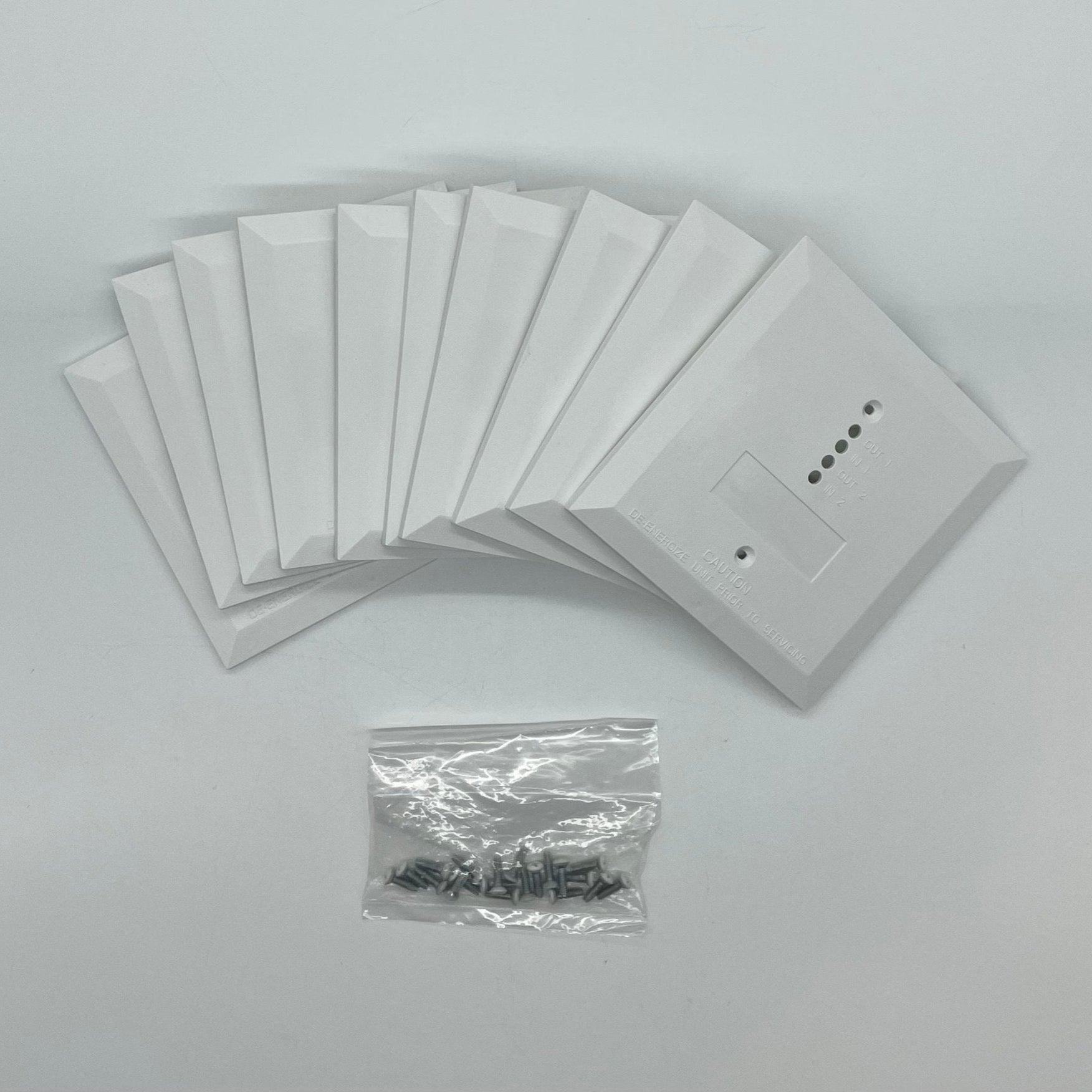 System Sensor FP-WHITE-2-BP fire alarm with white plastic housing, mounted on wall, featuring sensor and alarm components.