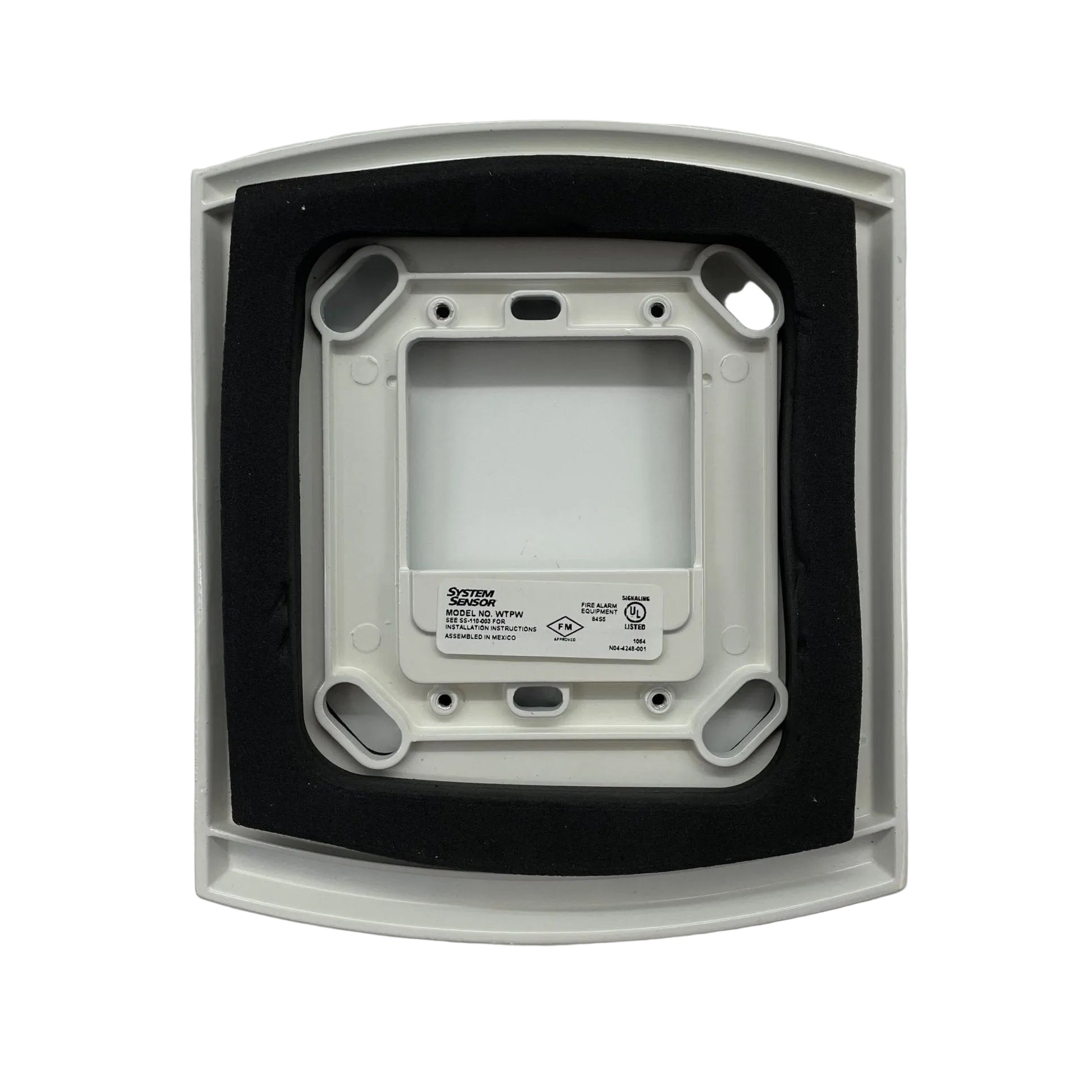 System Sensor WTPW fire alarm wall transformer mounted on a wall, compact and black with visible wiring connections.