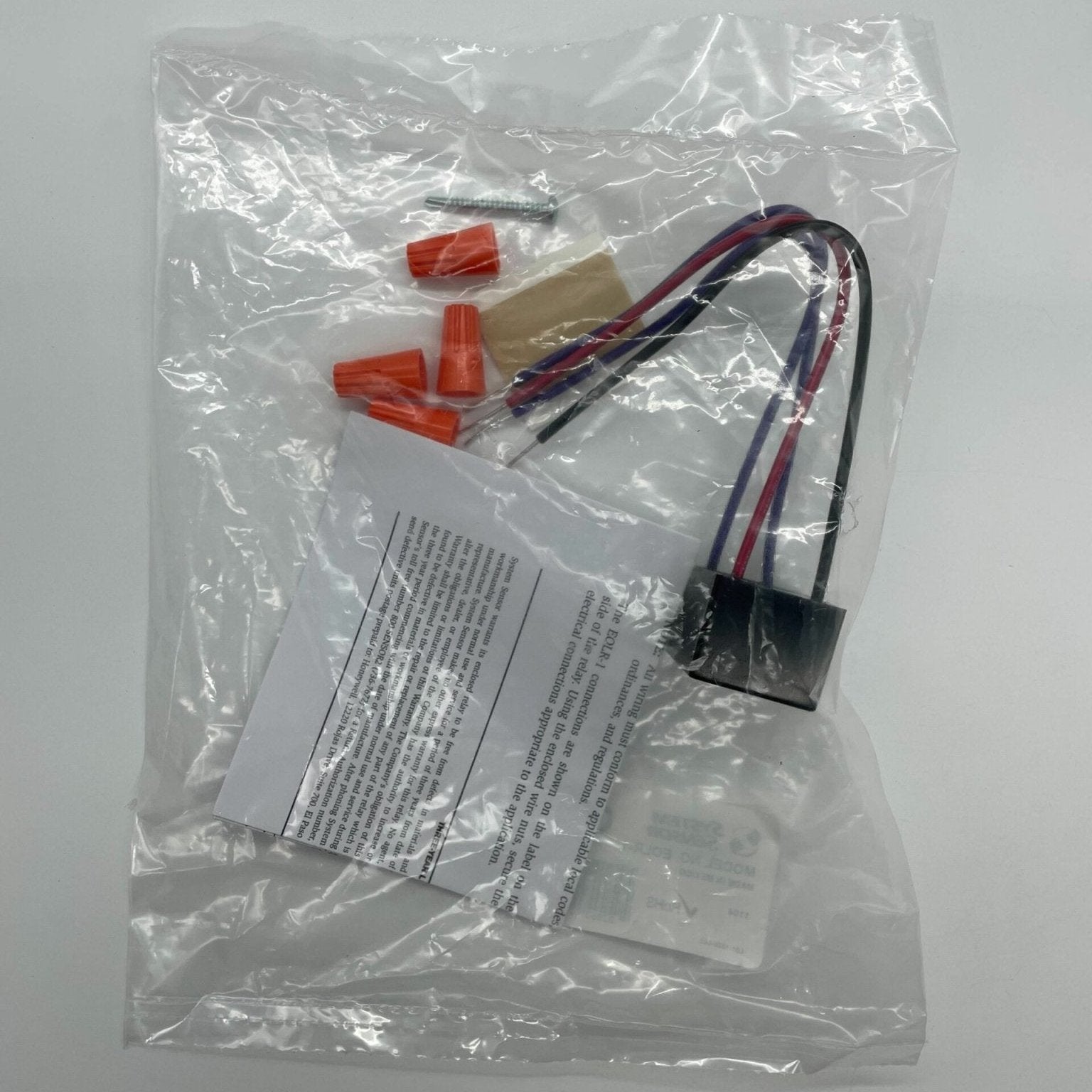 System Sensor EOLR-1 smoke detector with alarm and sensors, mounted on a ceiling for fire detection.