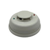 System Sensor 4WTR-B wireless temperature sensor with display, installed on a wall in a professional setting.