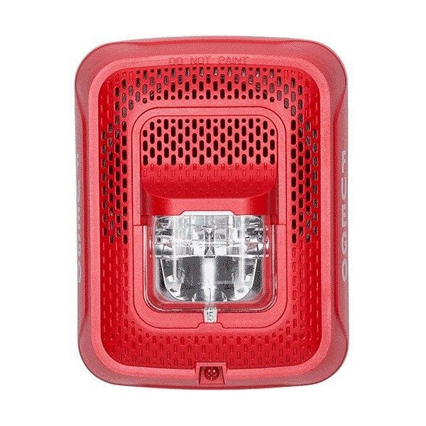 System Sensor SPSRL smoke detector with alarm test and silence button, mounted on ceiling in a commercial setting.