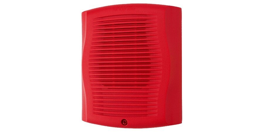 System Sensor SPR fire alarm sensor with detection components, mounted on a wall for fire safety monitoring.